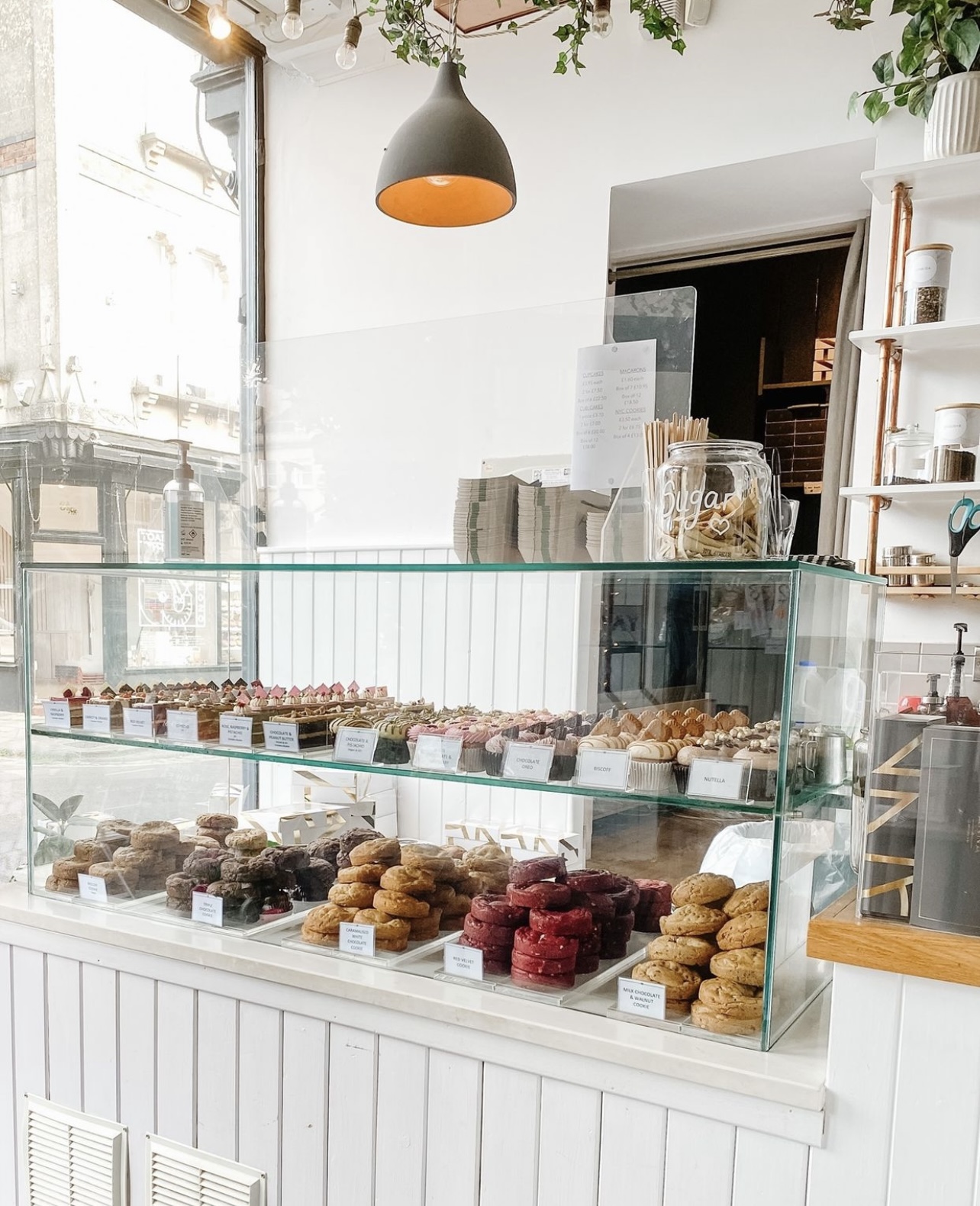 Cupcakes and Cookies on display in a shop.