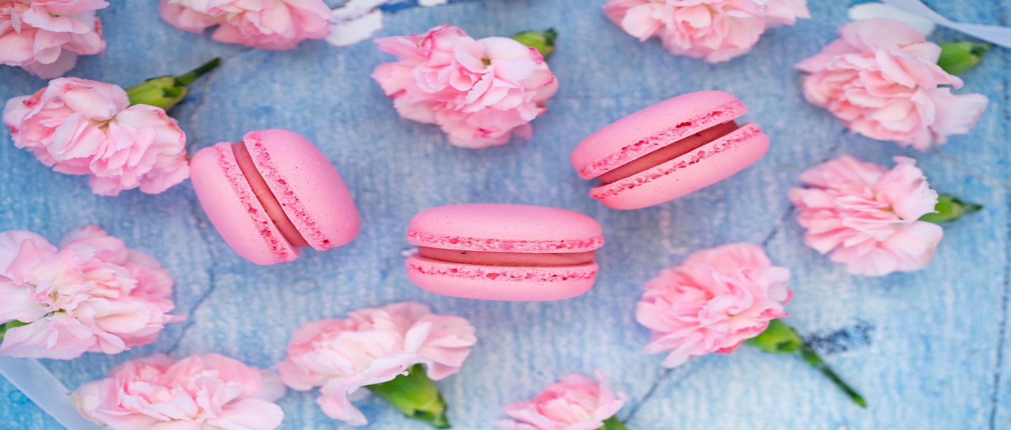 Pink macaroons with pink flowers