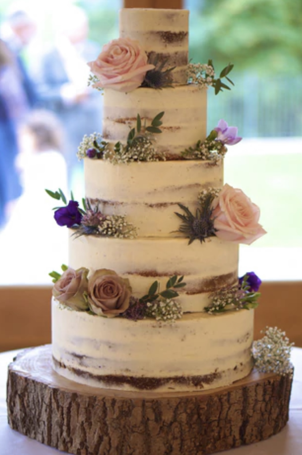 white naked cake with flowers